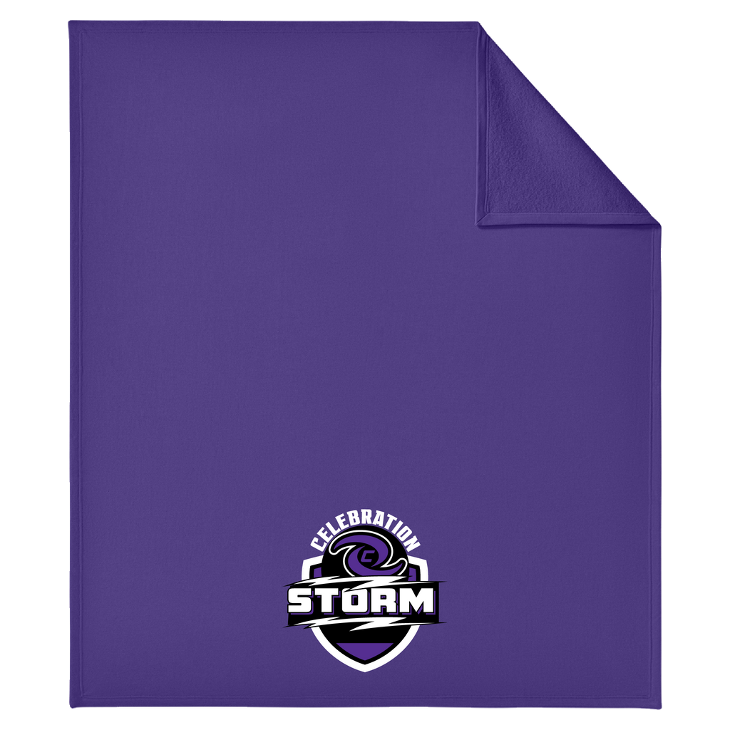 A purple blanket with a folded top-right corner, featuring a 'Celebration Storm' shield logo printed near the bottom center. The logo contains a purple storm cloud graphic with white and black text.