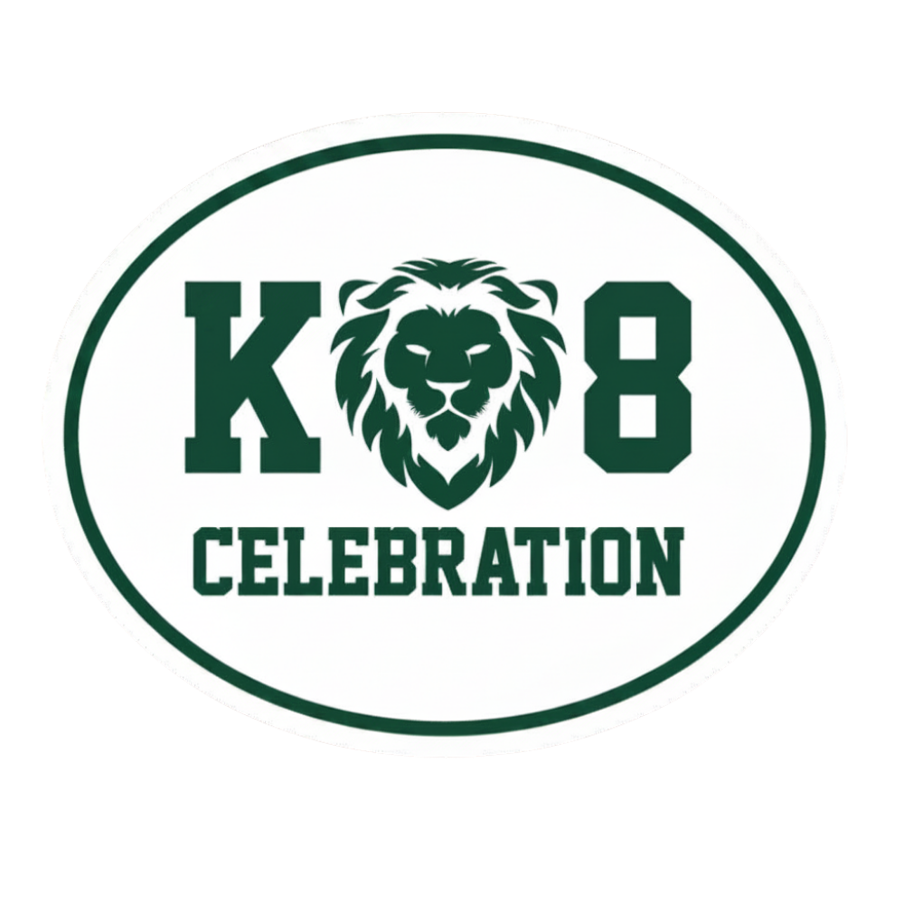 An oval white magnet with a dark green border and text reading 'K 8 CELEBRATION', featuring a green lion head emblem between the letters.